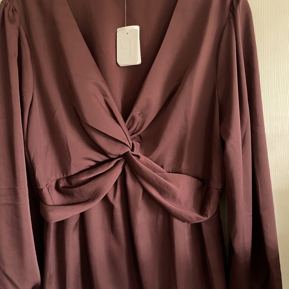 Super sexy and slimming Satan finish blouse.